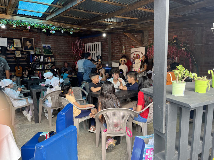Kids gathered at a workshop table